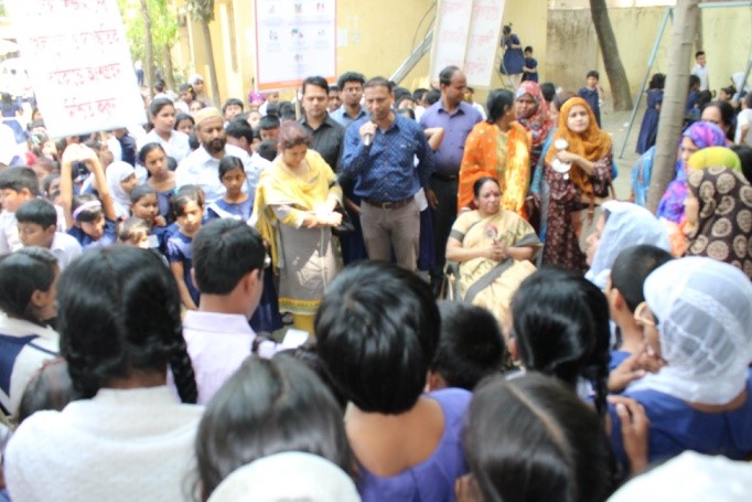 man talking to students