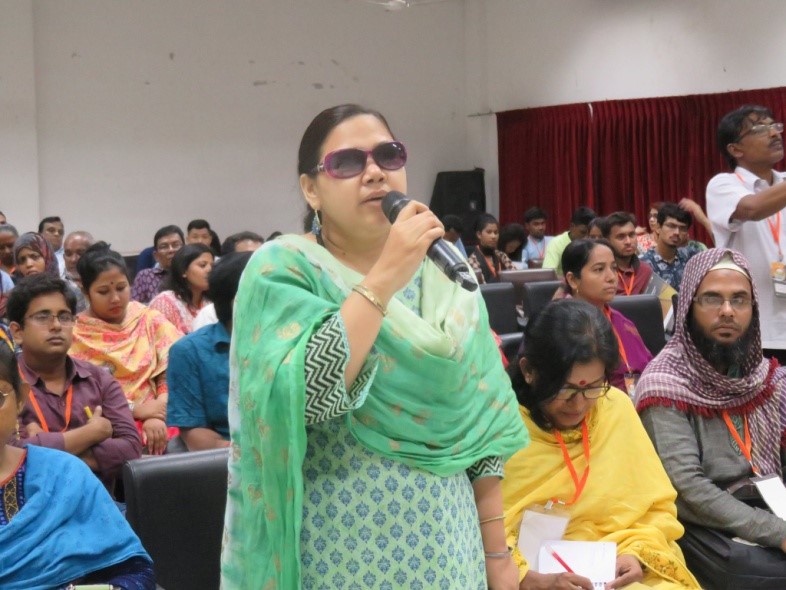 Woman speaking in Budget assembly