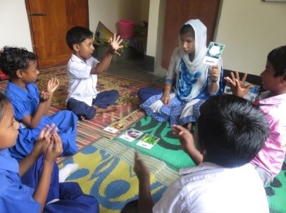 Deaf children practicing sign language