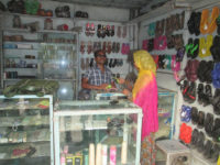 man working in shoe shop