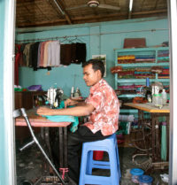 man working with sewing machine